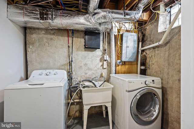 washroom featuring independent washer and dryer and electric panel