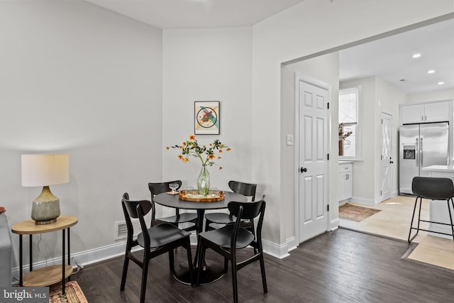 dining room with dark hardwood / wood-style floors