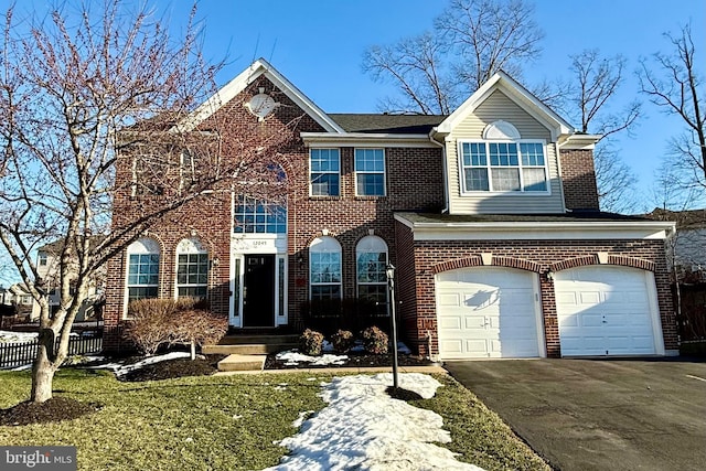 view of front facade with a garage and a front yard