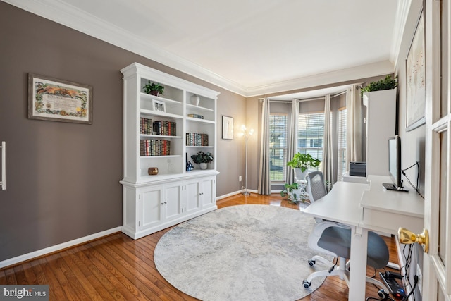 office area with ornamental molding and light hardwood / wood-style flooring