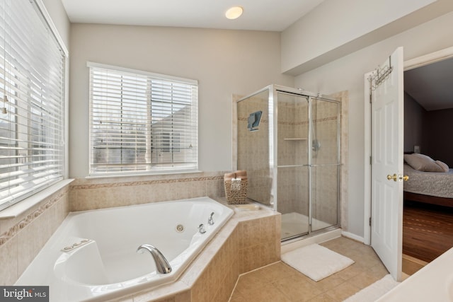 bathroom featuring plus walk in shower and tile patterned floors