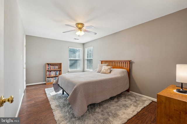 bedroom featuring ceiling fan and dark hardwood / wood-style flooring