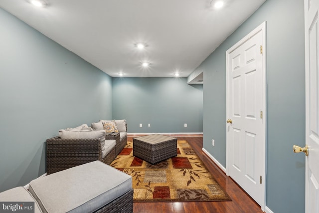 living area with dark hardwood / wood-style flooring