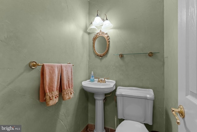 bathroom with sink and toilet