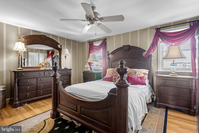 bedroom featuring ceiling fan and light hardwood / wood-style flooring