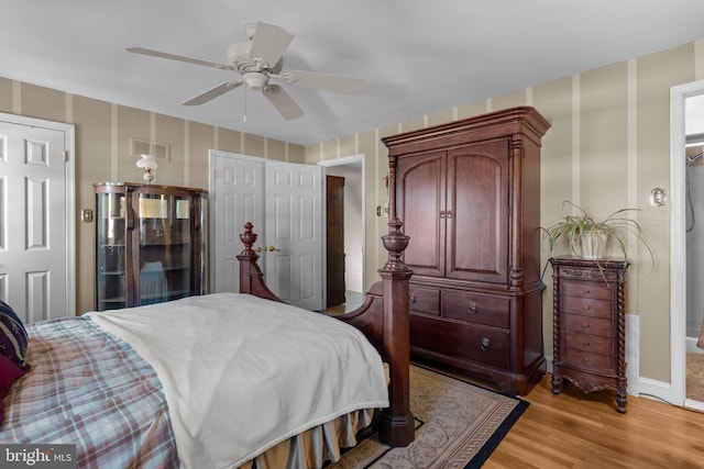 bedroom with light hardwood / wood-style flooring and ceiling fan