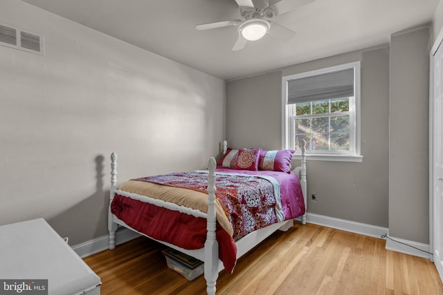 bedroom with ceiling fan and light hardwood / wood-style floors