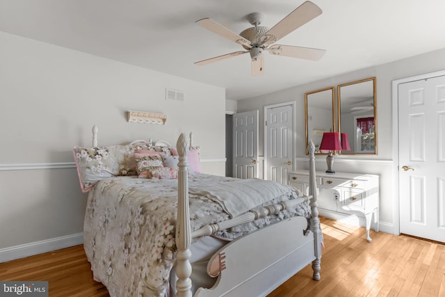 bedroom with hardwood / wood-style flooring and ceiling fan