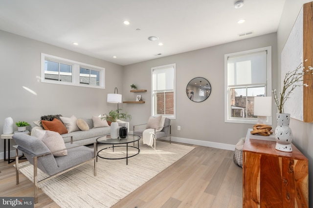 living room with light hardwood / wood-style flooring