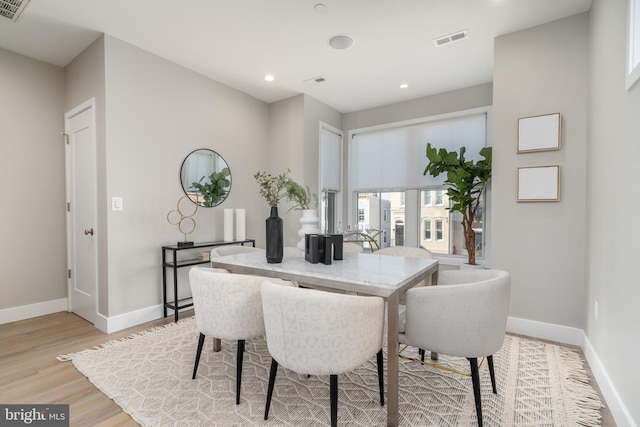 dining room with light hardwood / wood-style flooring