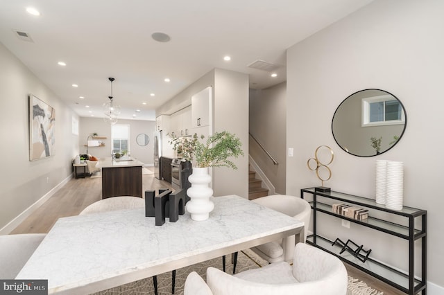 dining area with light hardwood / wood-style floors