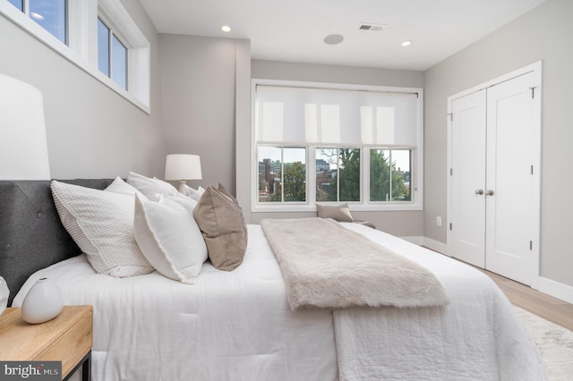 bedroom with light wood-type flooring