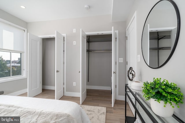 bedroom featuring a closet and light wood-type flooring