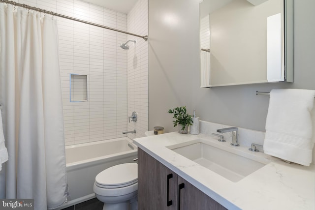 full bathroom featuring vanity, shower / bath combination with curtain, and toilet