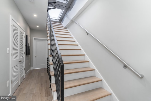 stairway featuring hardwood / wood-style floors