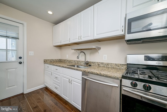 kitchen featuring white cabinetry, stainless steel appliances, dark hardwood / wood-style flooring, and sink