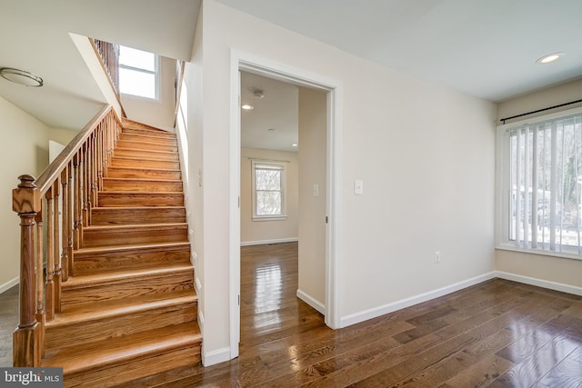 staircase featuring hardwood / wood-style flooring