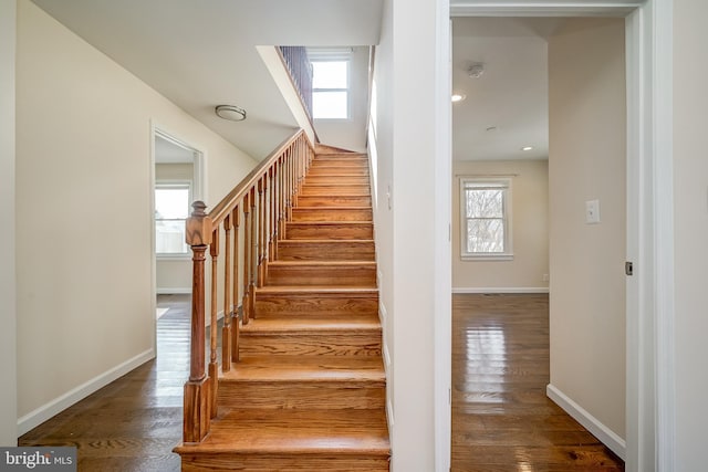 stairs with hardwood / wood-style floors