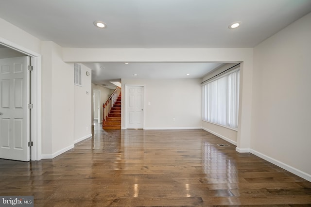 empty room with dark hardwood / wood-style floors