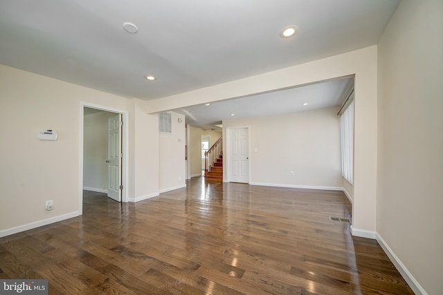 empty room featuring dark hardwood / wood-style flooring