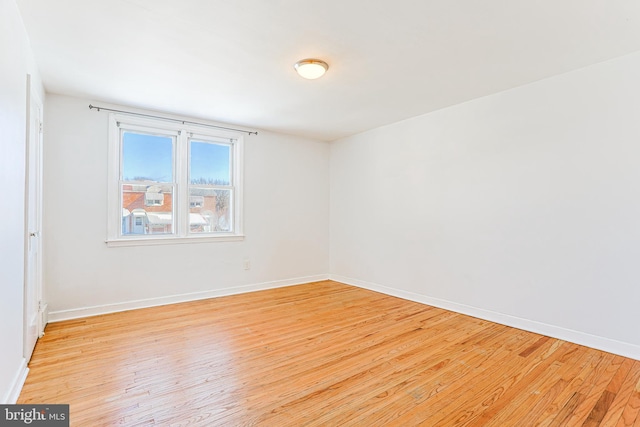 spare room featuring light wood-type flooring