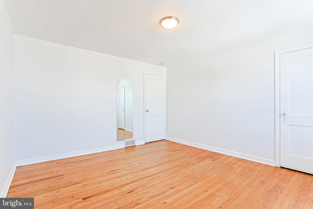 unfurnished room with light hardwood / wood-style floors