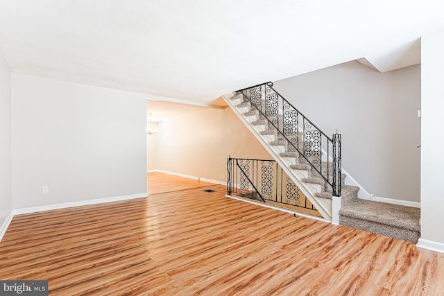 interior space featuring a chandelier and hardwood / wood-style floors