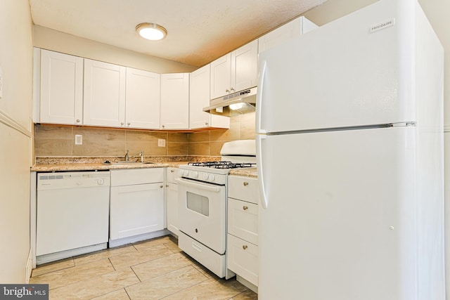 kitchen with sink, white appliances, decorative backsplash, and white cabinets