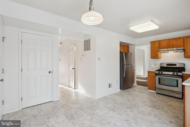 kitchen featuring stainless steel appliances and pendant lighting