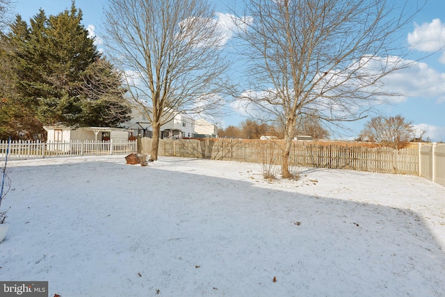 view of yard covered in snow