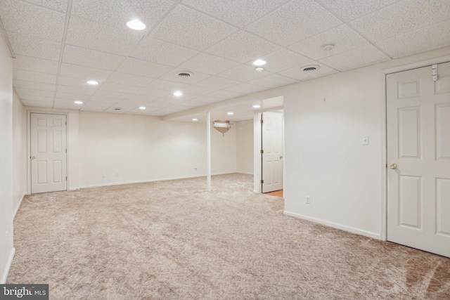 basement featuring light colored carpet