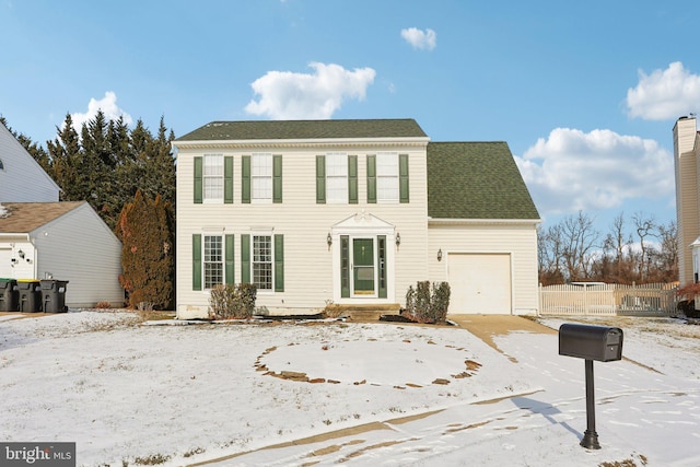 colonial inspired home featuring a garage