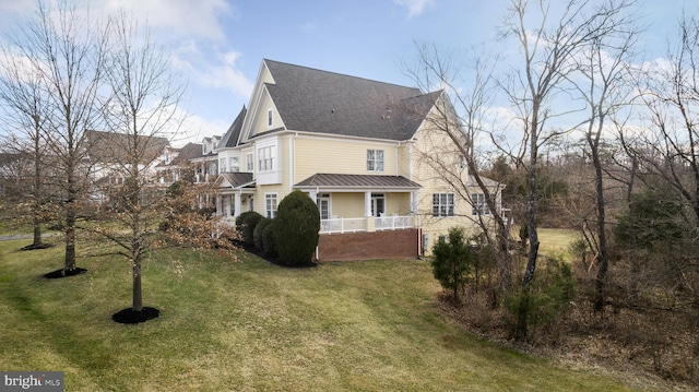 view of property exterior featuring a lawn