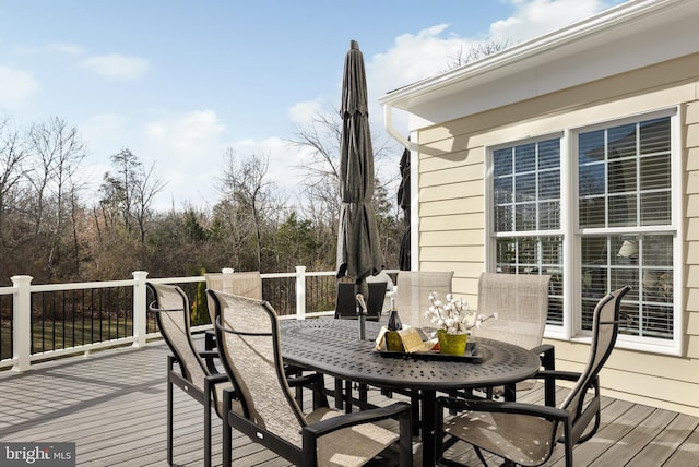 wooden deck featuring outdoor dining space