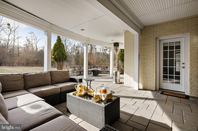 sunroom featuring a healthy amount of sunlight