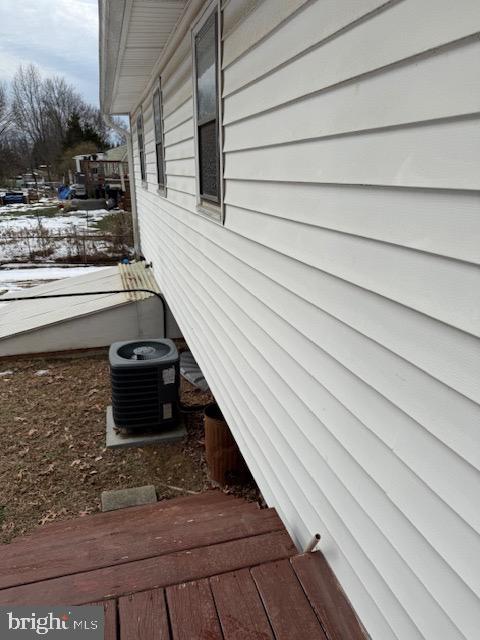 view of side of property with central AC unit