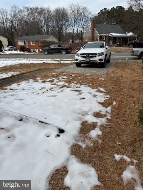 view of yard layered in snow