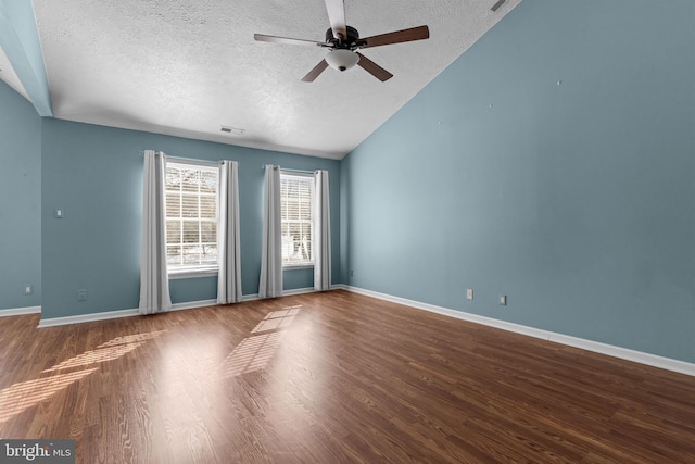 spare room featuring hardwood / wood-style flooring, vaulted ceiling, ceiling fan, and a textured ceiling