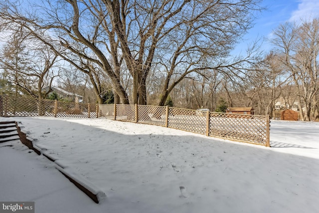 view of yard covered in snow