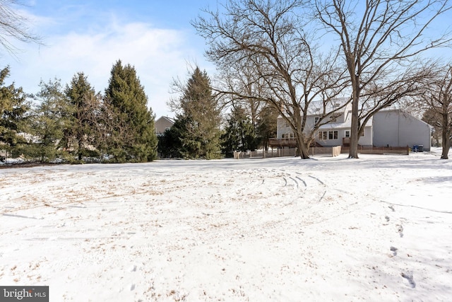 view of yard layered in snow