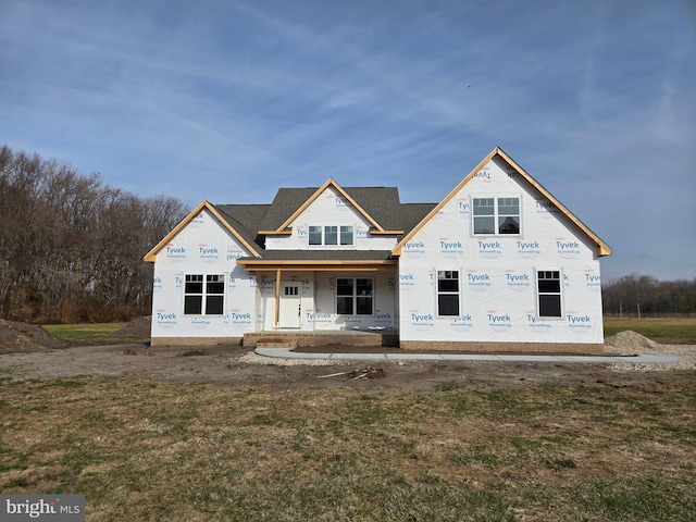 rear view of house with a lawn