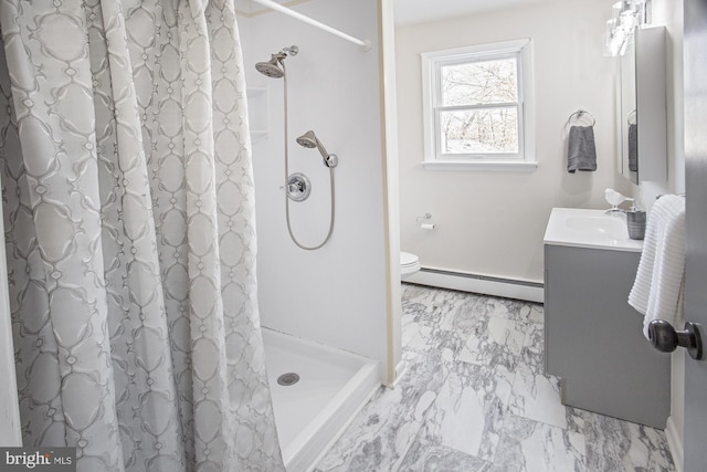 bathroom featuring vanity, walk in shower, toilet, and baseboard heating