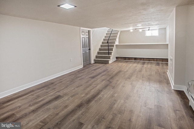 basement featuring dark wood-type flooring