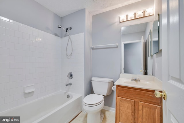 full bathroom featuring tiled shower / bath combo, vanity, toilet, tile patterned floors, and a textured ceiling