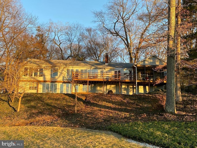 rear view of house with a lawn