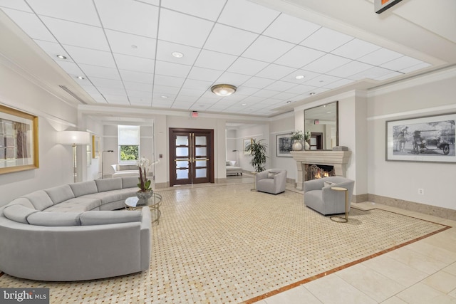 living room with crown molding, tile patterned floors, and french doors