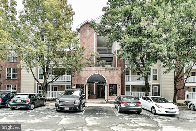 view of property featuring uncovered parking