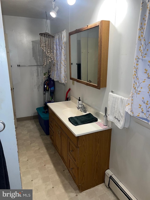 bathroom featuring vanity and a baseboard radiator