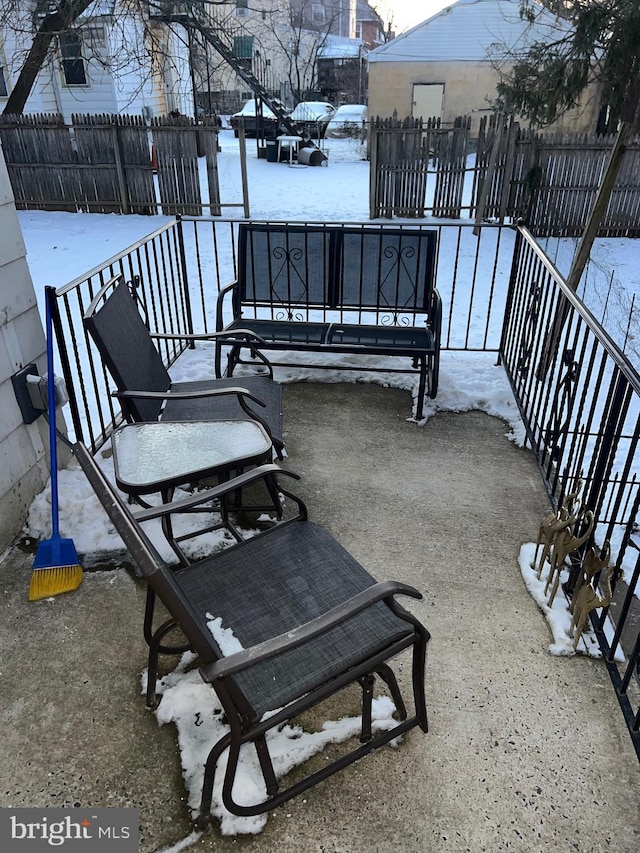 view of snow covered patio