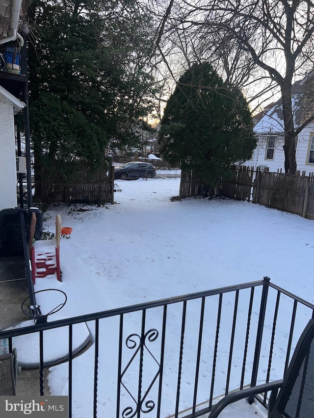 view of yard layered in snow